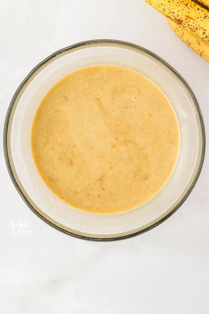 wet ingredients in a clear glass bowl whisked together