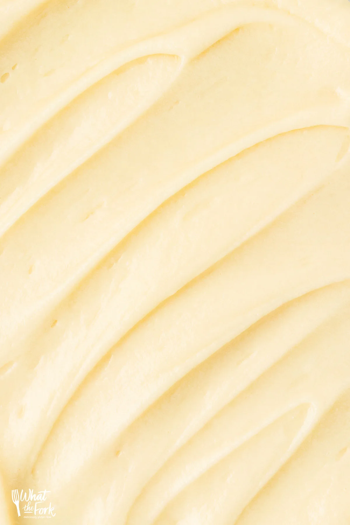 close up of Maple Cream Cheese Frosting Recipe with Real Maple Syrup spread on top of a cake