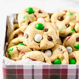 Gluten Free Cadbury Snowball Cookies in a Christmas plaid decorated cookie tin